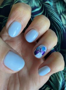 blue gel nails with butterfly art